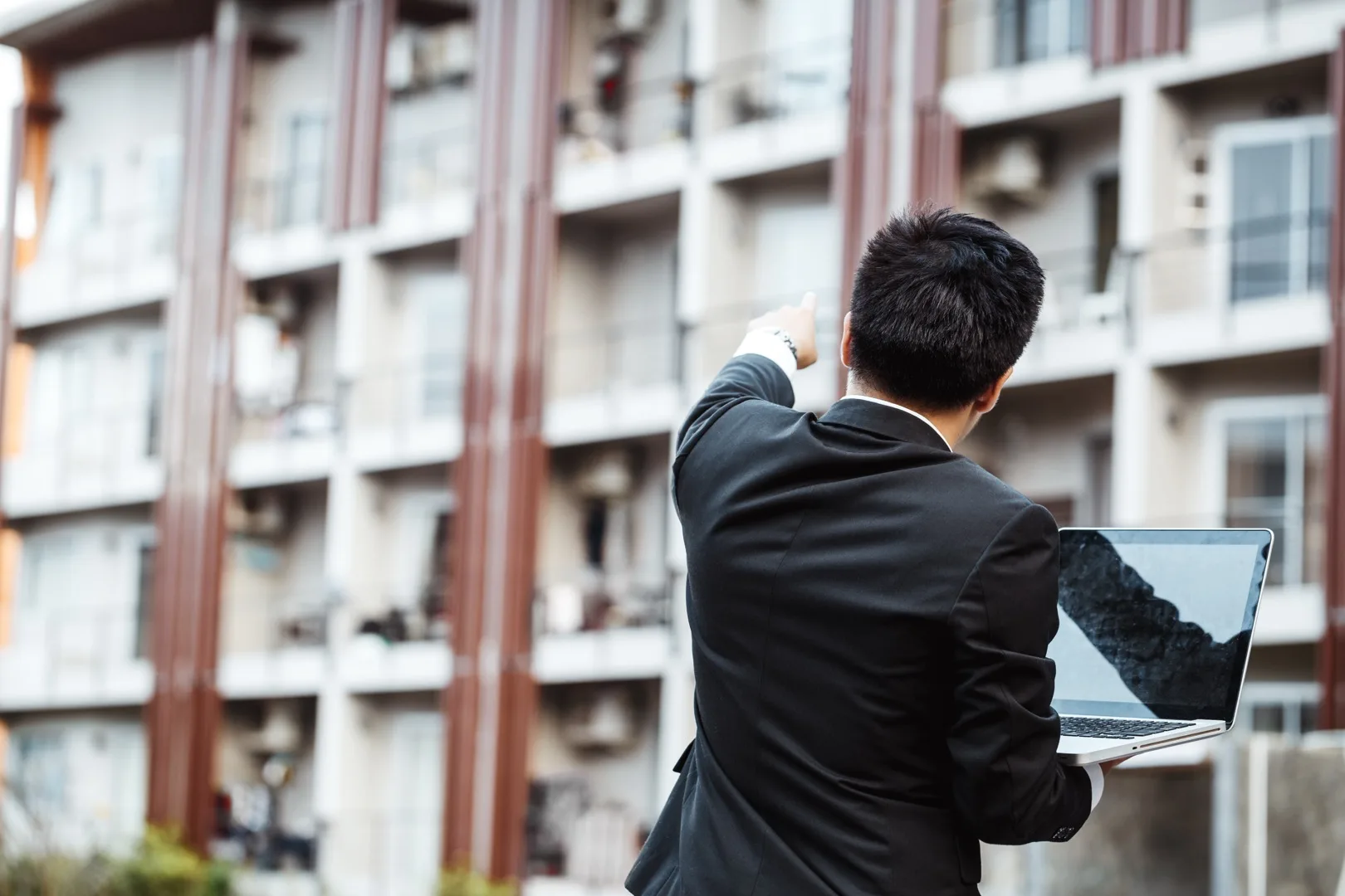 Business professional reviewing strategic plans and documents for evaluating a job offer