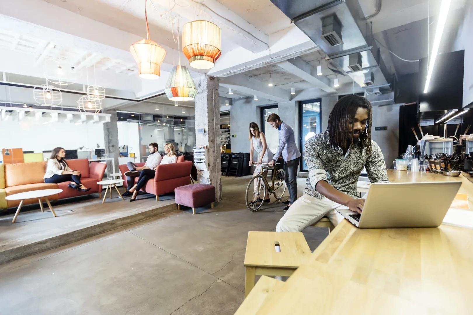 Developer working at desk comparing freelance and full-time salary options