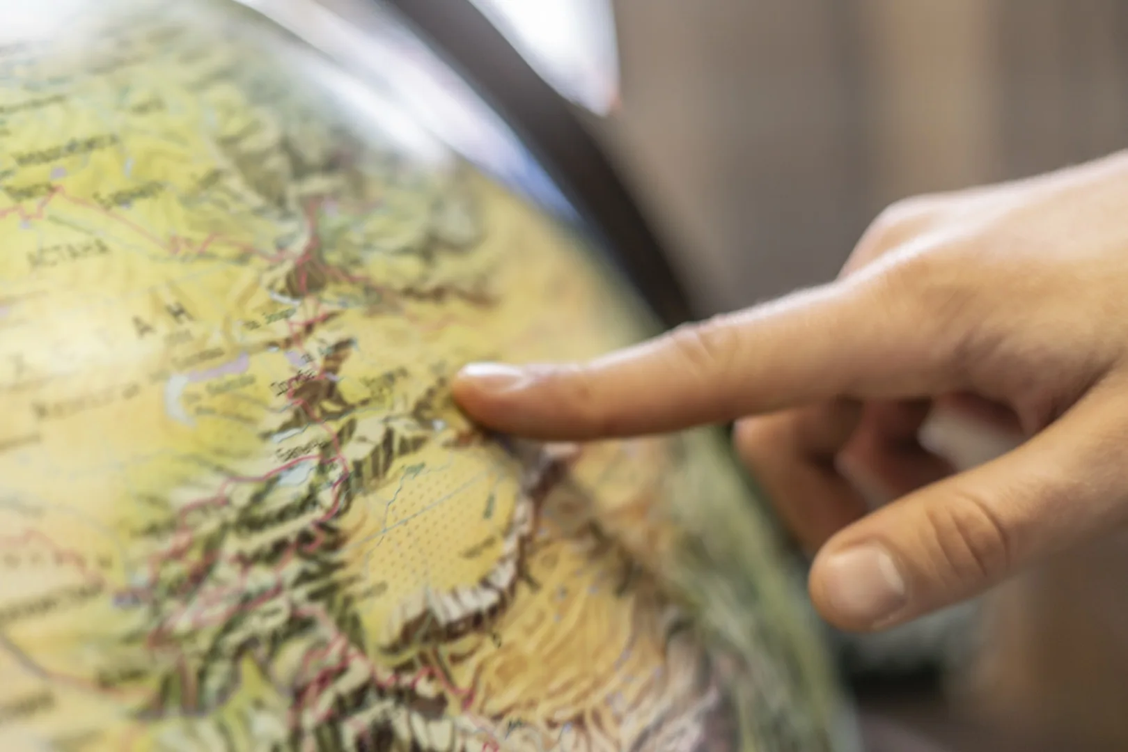 Globe with destination markers showing salary comparison opportunities across world cities