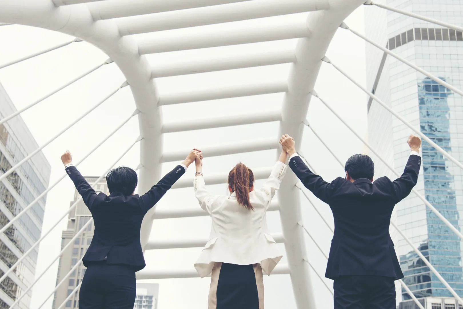 Diverse team of professionals walking through a modern office corridor